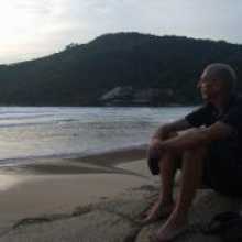 Reflecting whilst sat on a deserted beach.