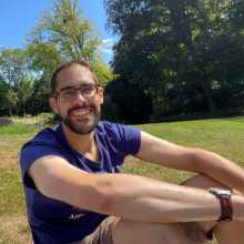 It's smiling me sitting on the grass, in the sunshine