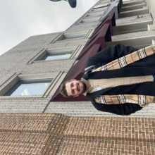 Me standing downtown posing for a photo