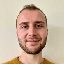 Photo of Oli - smiling.