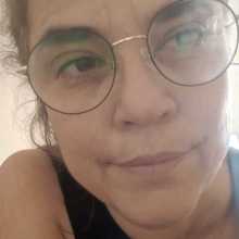 Juliana is a woman with dark hair and glasses.