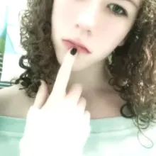 I have blue eyes, curly hair, and am tall.
