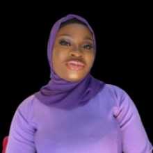 a young woman softly smiling