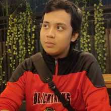 Wearing red jacket with black accent and leaves background behind me.