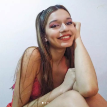 Picture of a girl smiling.