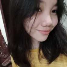Black hair, black eyes, smiling lookin like a weirdo, wearing a yellow shirt with white stripes. (This is a selfie by the way)