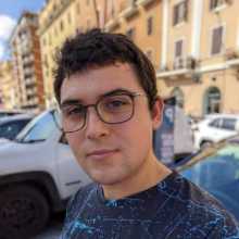 Italian man with glasses and round face