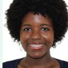 Young black woman, black coily hair, black eyes, wearing a black t-shirt