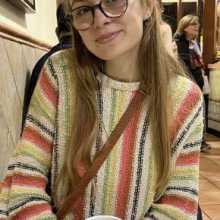 Smiling blonde girl with glasses