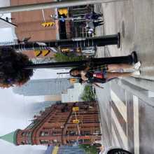 Stander by a pole on a street