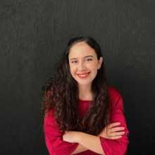 Young smiling woman arms crossed on her chest 