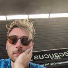 Me wearing sunglasses and blue shirt