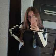 Brown hair, green eyes, glasses