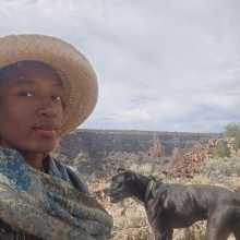 Erin Renée & her dog, Dominic with the Rio Grande gorge in the background