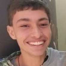 A white man with brown hair smilling