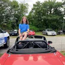 Me sitting on my Miata