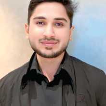 Professional headshot of Nabeel Ahmad wearing a dark shirt against a neutral background.
