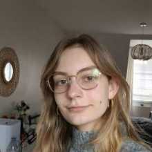 A selfie of a woman, blonde, glasses