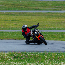 Man riding motorcycle on racetrack