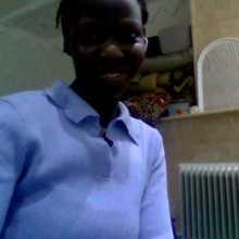 A WOMAN SMILING AT CAMERA