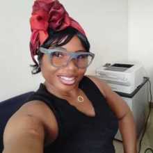 A casual headshot of me smiling in an office environment