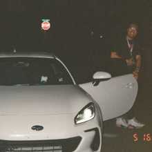 man by a car