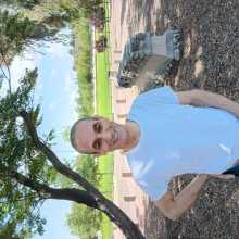 Man standing on the grass in a park