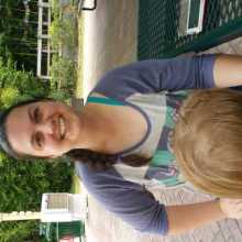 Woman with child outside smiling