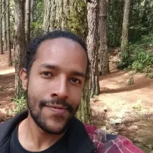 Young brunette man i'm the woods