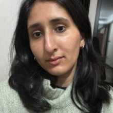 Brown girl in a green sweater