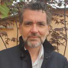 Profile picture of a smiling Italian man