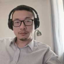 Profile photo of a man wearing glasses and headphones.