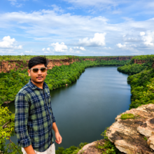 Kuldeep standing beside a river in Rajasthan