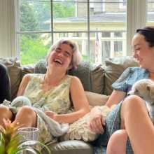 A family sitting on a couch