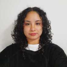 I have curly hair and small eyes.