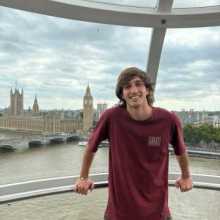 I'm Lisandro, 22 years old, standing inside a pod on the London Eye with the River Thames behind me