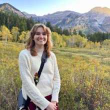 Woman in mountain meadow