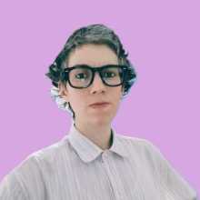 Portrait of Madeline wearing glasses and a shirt, shown from the head to the upper torso against a pink background.