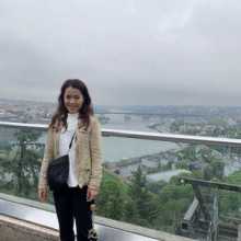A full-length photo of a Japanese woman at a tourist attraction in Turkey